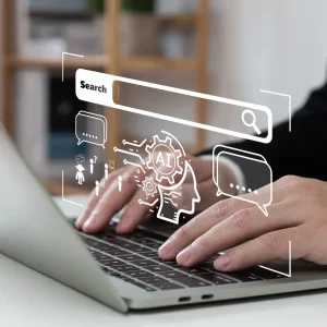 Man's hands on a laptop with a popup search that indicates that AI is working behind the scenes.